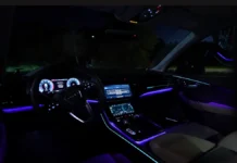 Inside the 2025 Audi SQ7: Interior Luxury, Tech Stack, and 3-Row Utility Wide-angle premium shot of the 2025 Audi SQ7 luxury interior cabin layout, highlighting the sport steering wheel, ambient lighting, and dual screens.