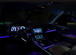 Inside the 2025 Audi SQ7: Interior Luxury, Tech Stack, and 3-Row Utility Wide-angle premium shot of the 2025 Audi SQ7 luxury interior cabin layout, highlighting the sport steering wheel, ambient lighting, and dual screens.