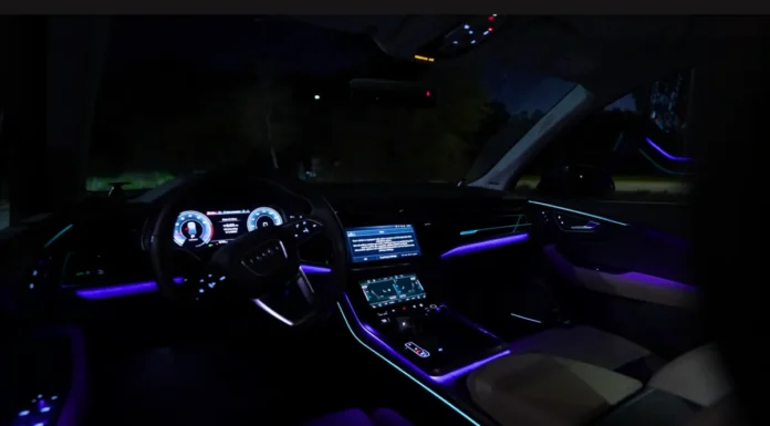 Inside the 2025 Audi SQ7: Interior Luxury, Tech Stack, and 3-Row Utility Wide-angle premium shot of the 2025 Audi SQ7 luxury interior cabin layout, highlighting the sport steering wheel, ambient lighting, and dual screens.