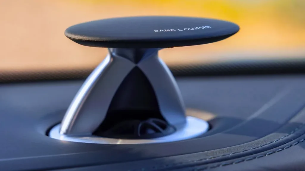 The motorized acoustic lens tweeter of the premium Bang and Olufsen 3D Advanced Sound System on the dashboard.