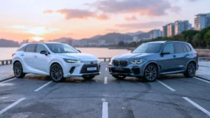 A silver 2026 BMW X5 xDrive50e plug-in hybrid SUV is parked next to a 2026 Lexus RX family hybrid luxury SUV.