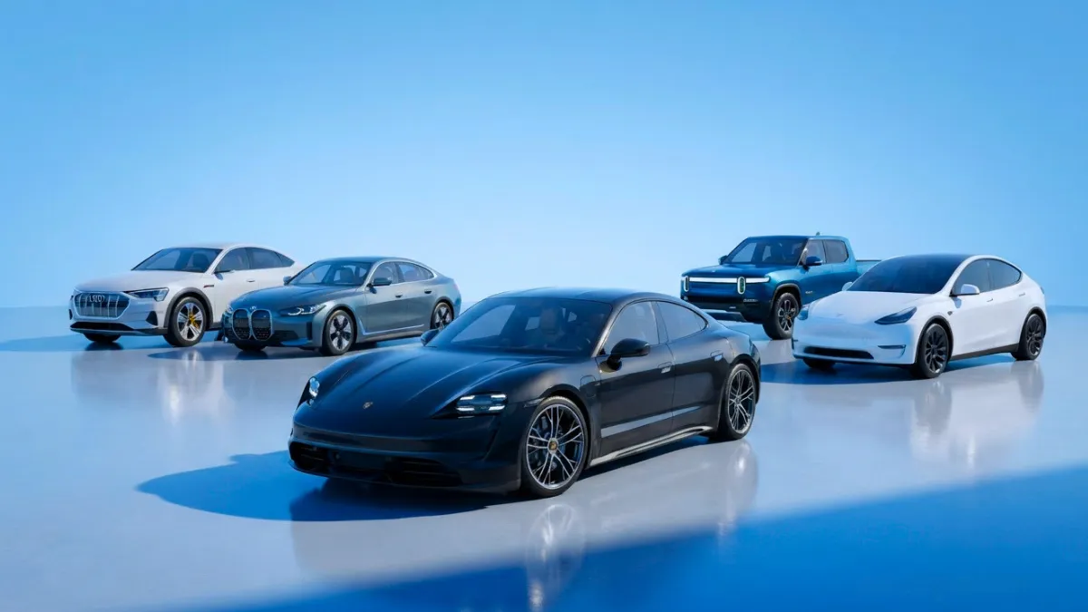 Modern electric vehicles lineup featuring electric cars, SUVs, and trucks in a clean sky-blue digital studio.