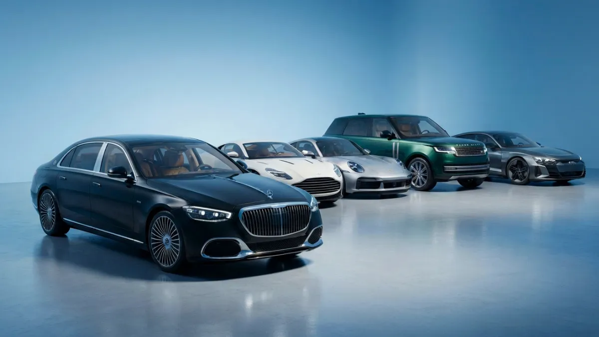 Modern luxury vehicles lineup featuring premium sedans, SUVs, coupes, and electric luxury cars in a sky-blue digital studio.