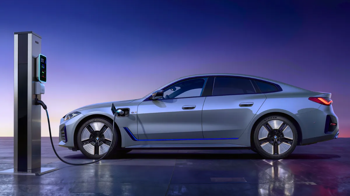 Electric BMW i4 charging at EV fast charger station