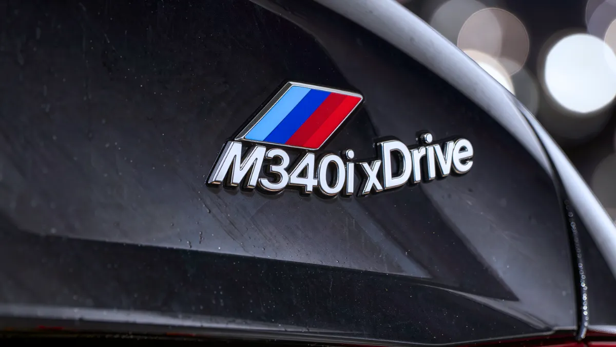 BMW M340i xDrive trunk badge highlighting BMW naming convention and trim designation